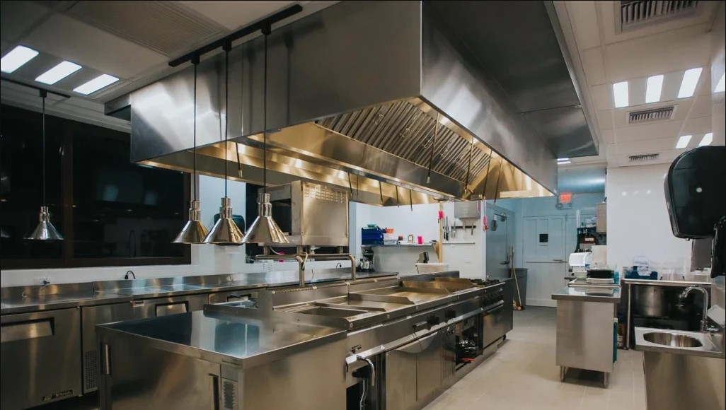 Engineers and chefs in an industrial kitchen
